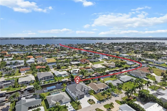 a view of a house with a yard and garage