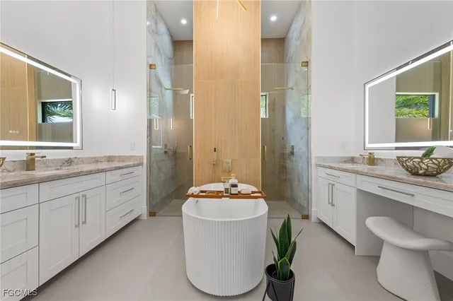 a bathroom with a granite countertop sink toilet a mirror and shower