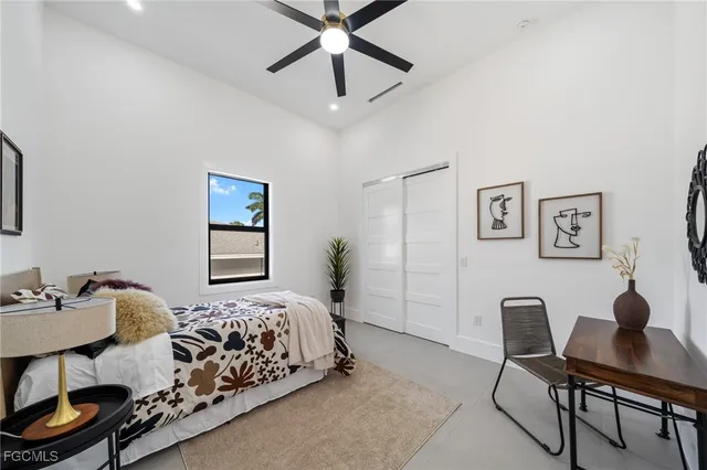 a bedroom with a bed and a desk