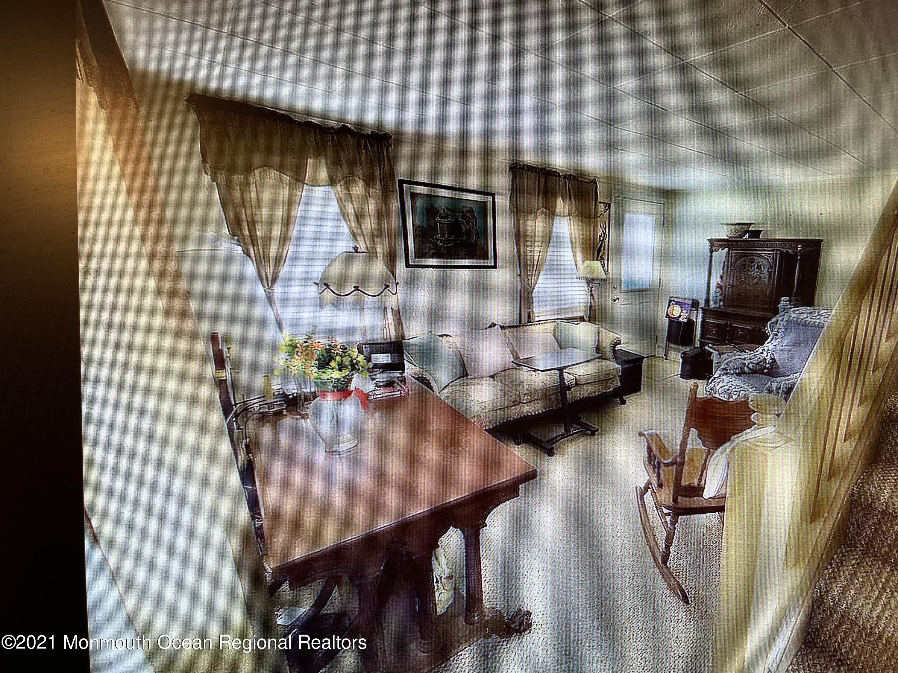 803 Wall Road Spring Lake Heights, NJ 07762 - Photo 2 of 9 a living room with furniture and a flat screen tv