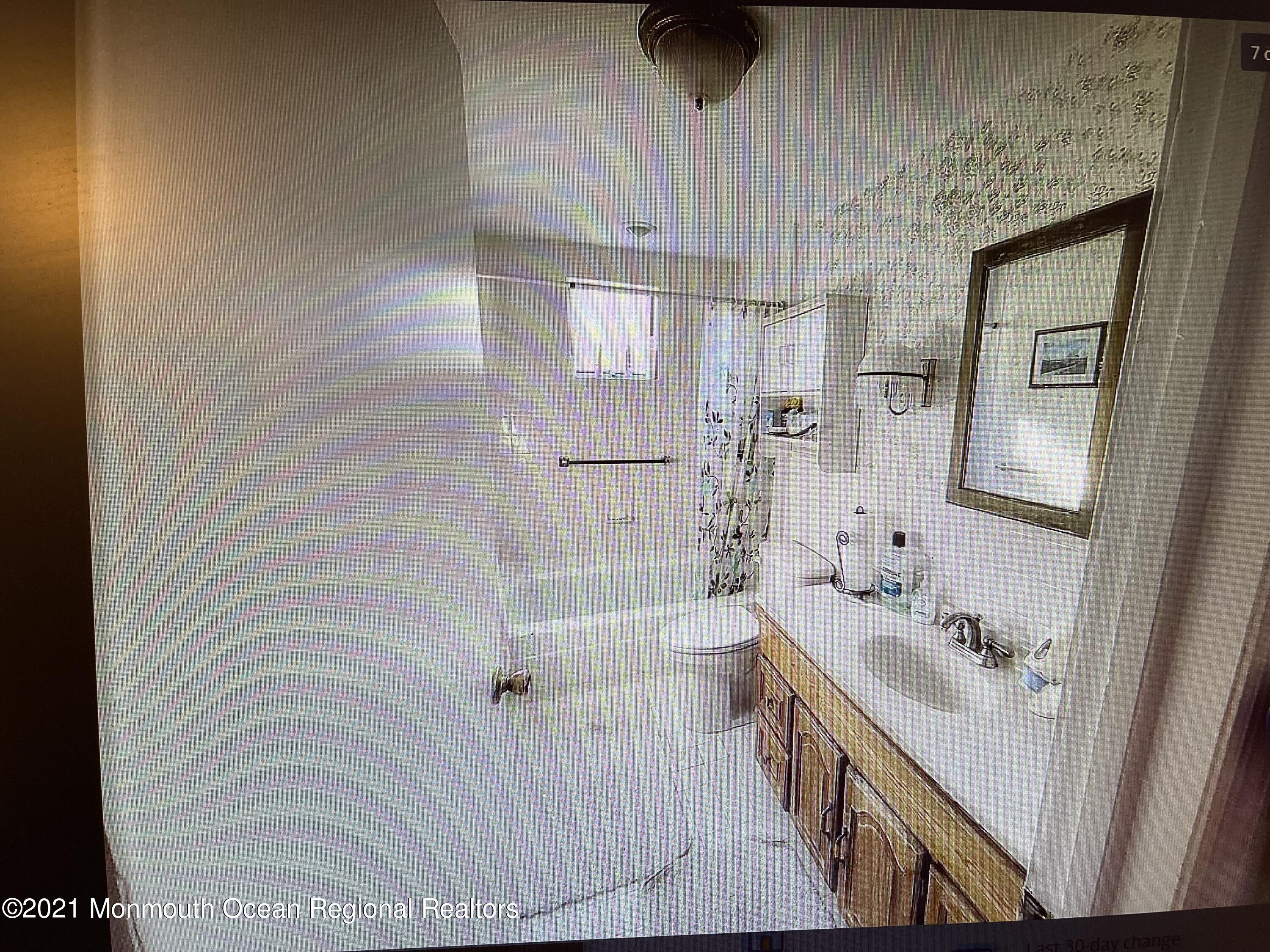803 Wall Road Spring Lake Heights, NJ 07762 - Photo 4 of 9 a bathroom with a sink and a bathtub