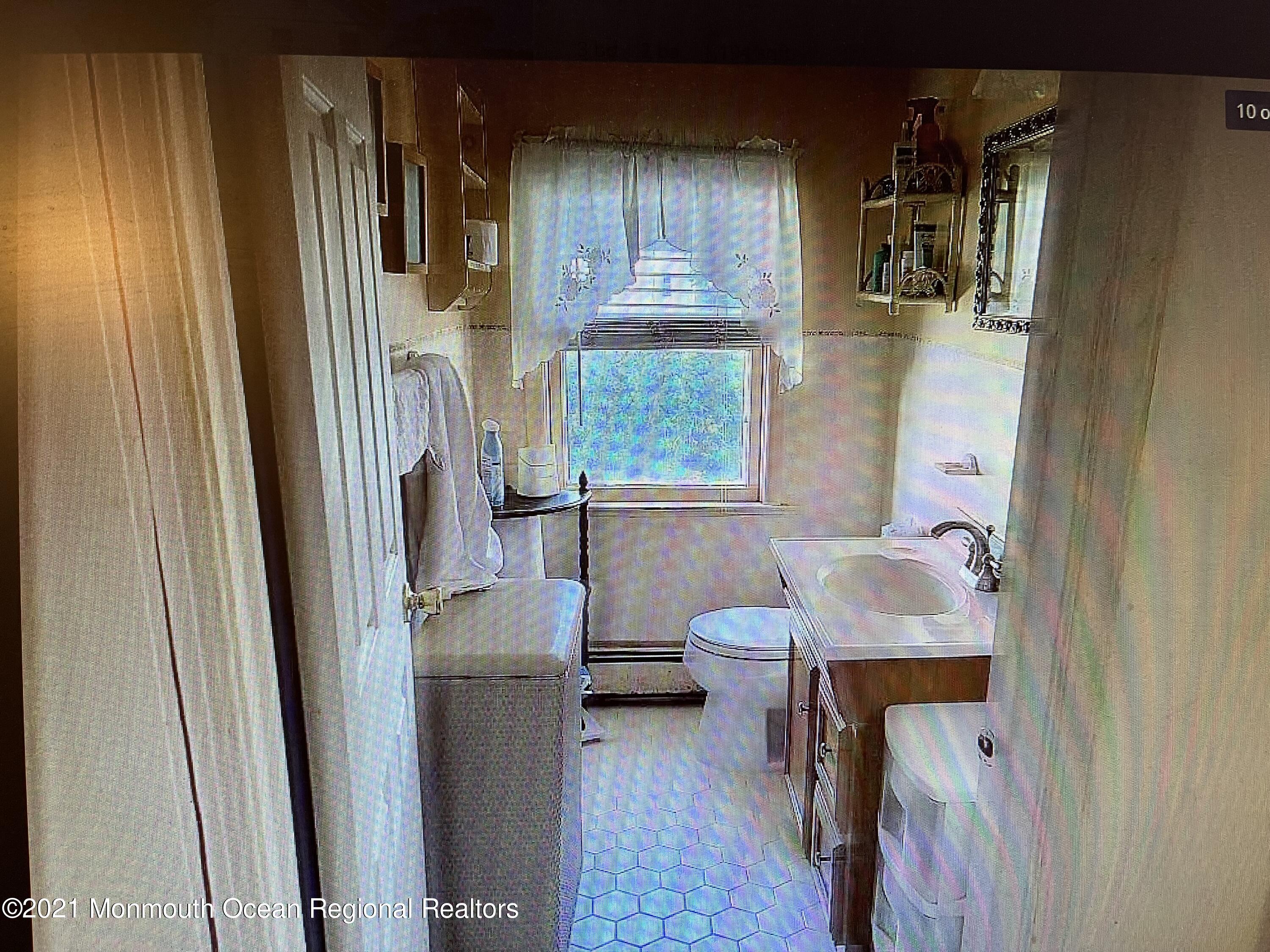 803 Wall Road Spring Lake Heights, NJ 07762 - Photo 7 of 9 a bathroom with a sink toilet and shower