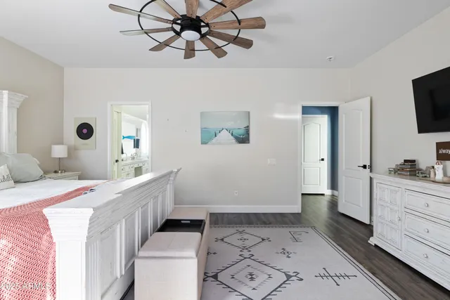 a room with a bed and a chandelier