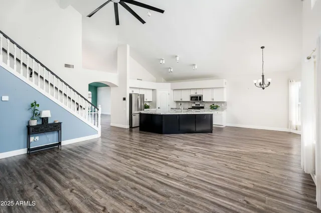 a view of kitchen and hall with wooden floor