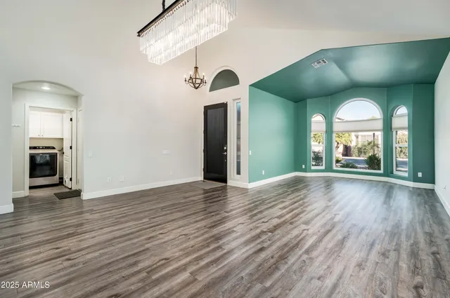 a view of a living room with wooden floor