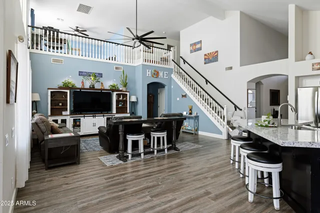 a view of a dining room with furniture wooden floor and a chandelier