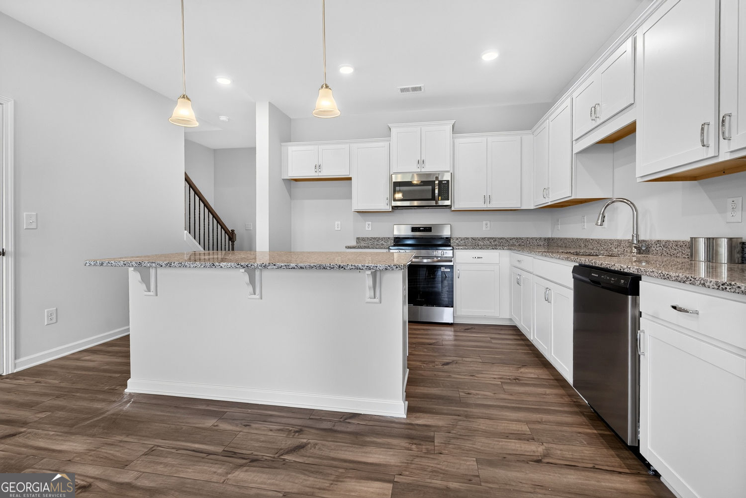 155 Oconee Road, Unit 252 Cartersville, GA 30120 - Photo 13 of 39 a large kitchen with stainless steel appliances granite countertop a stove a sink and a refrigerator
