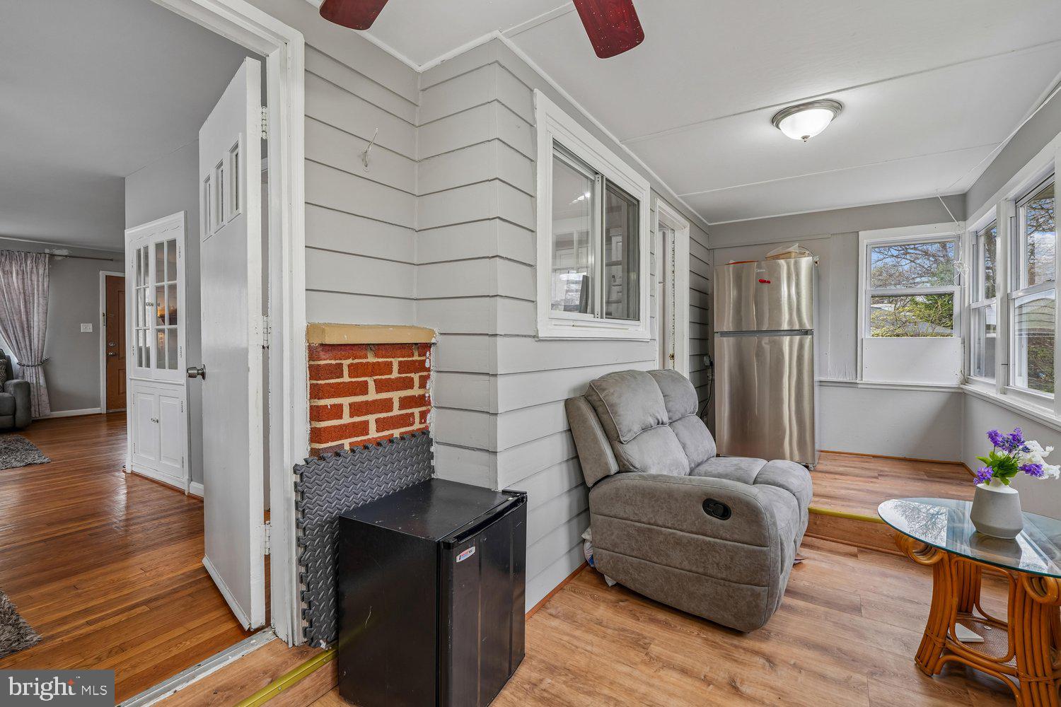 10128 Dallas Avenue Silver Spring, MD 20901 - Photo 12 of 29 a living room with furniture and a fireplace