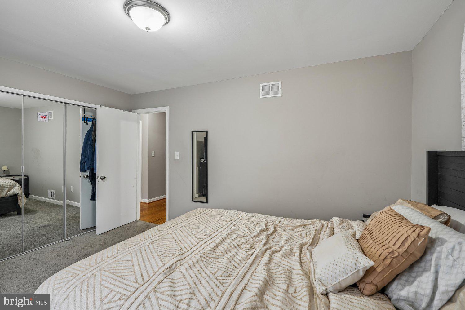 10128 Dallas Avenue Silver Spring, MD 20901 - Photo 16 of 29 a bedroom with a bed and a flat screen tv