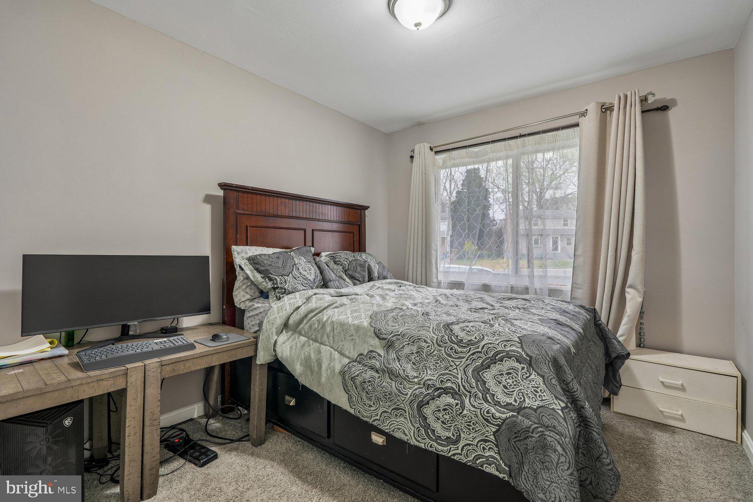 10128 Dallas Avenue Silver Spring, MD 20901 - Photo 20 of 29 a bedroom with a bed and a window