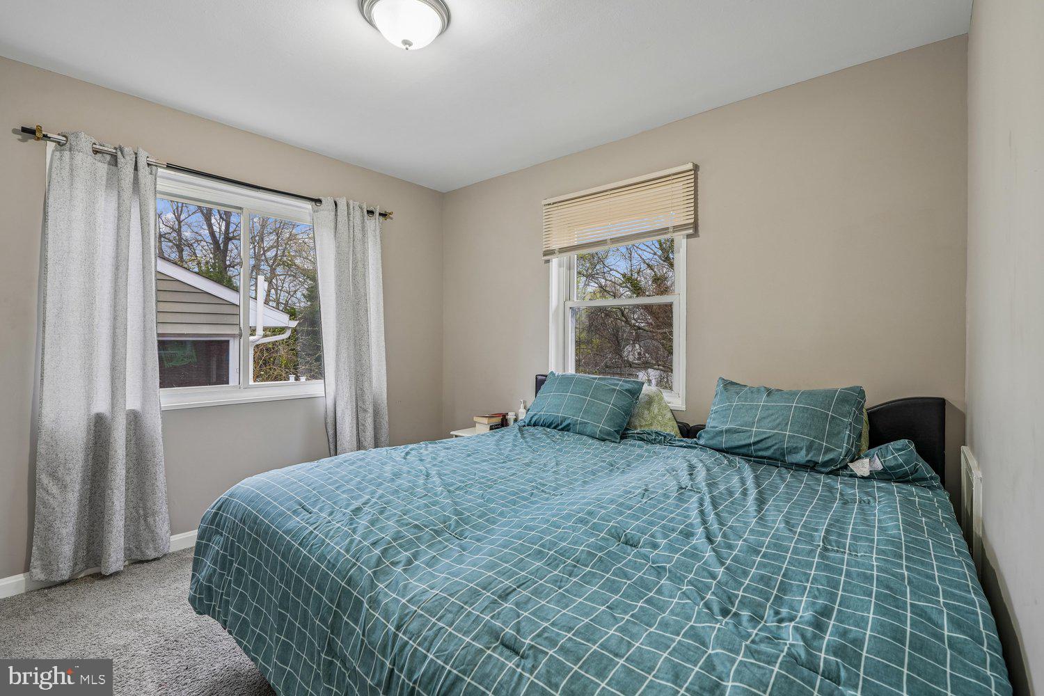 10128 Dallas Avenue Silver Spring, MD 20901 - Photo 22 of 29 a bedroom with a bed and window