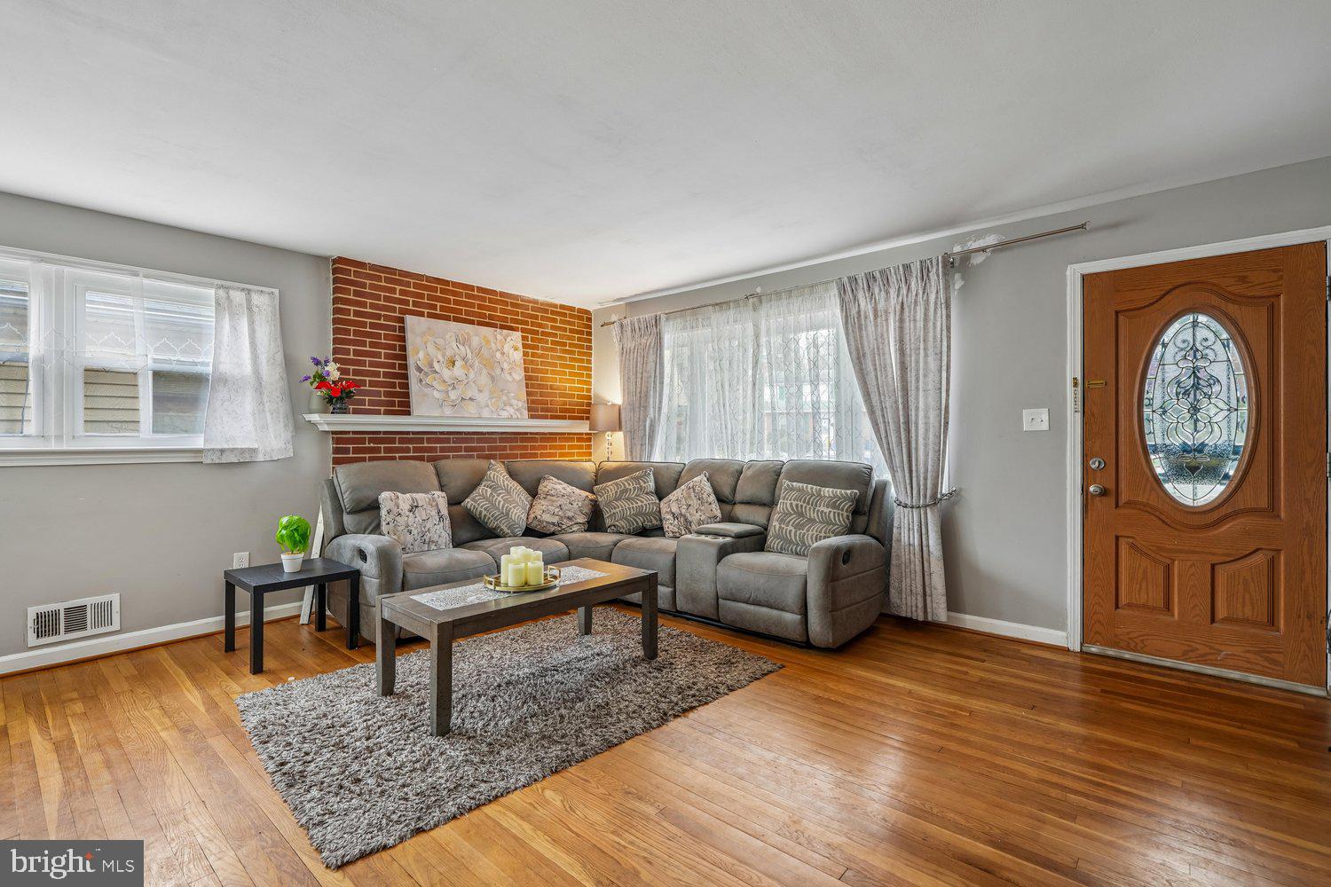 10128 Dallas Avenue Silver Spring, MD 20901 - Photo 3 of 29 a living room with furniture rug and window