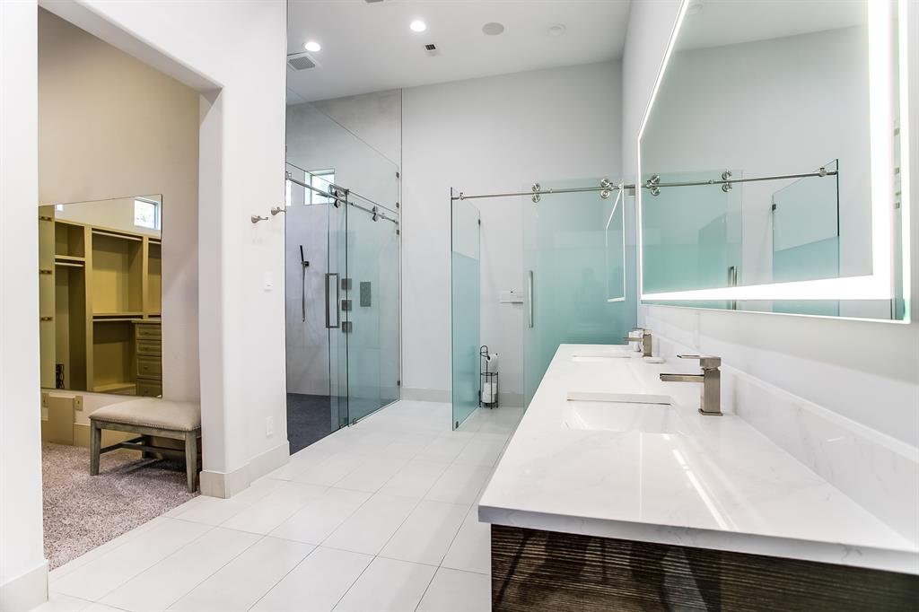 6319 Turner Way Dallas, TX 75230 - Photo 16 of 36 a bathroom with a sink a toilet and shower