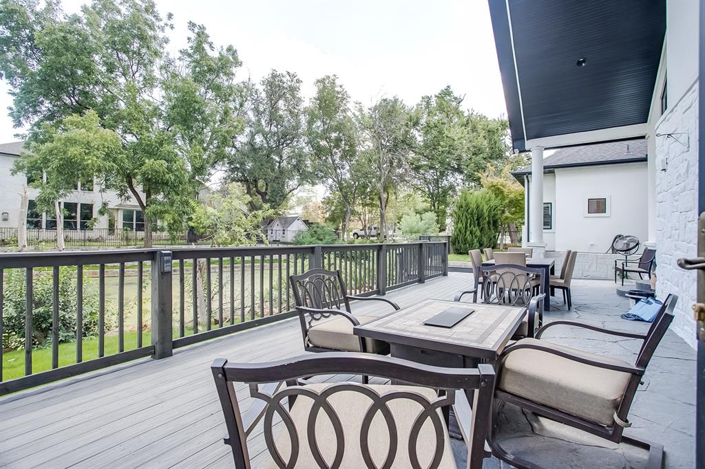 6319 Turner Way Dallas, TX 75230 - Photo 24 of 36 a view of a patio with table and chairs and wooden floor