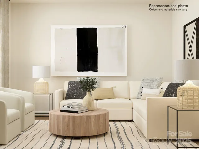 a living room with furniture a rug and white walls