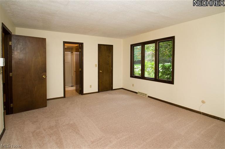 2610 Addyston Road Akron, OH 44313 - Photo 10 of 20 Master Bedroom - This 17x13 bedroom features a remodeled master bath and 6x6 walk in closet with built-in wood shelves
