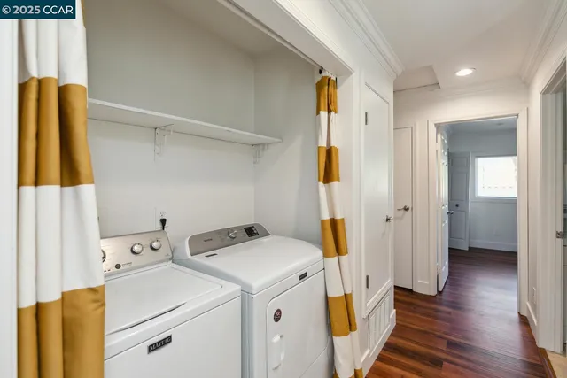 a view of walk in closet with wooden floor and window