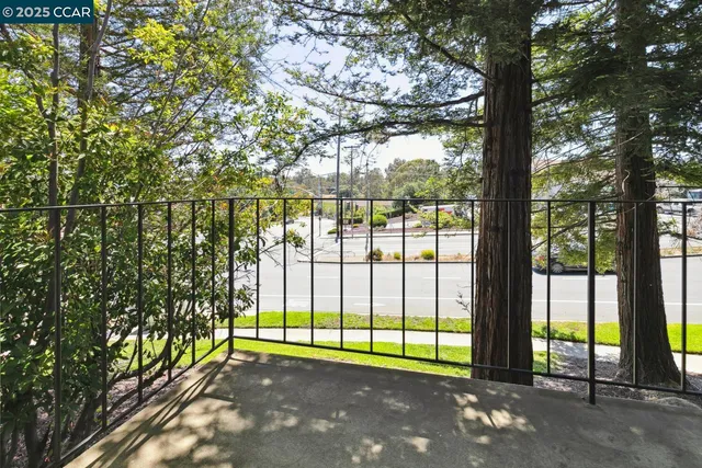 a view of a garden with an outdoor seating