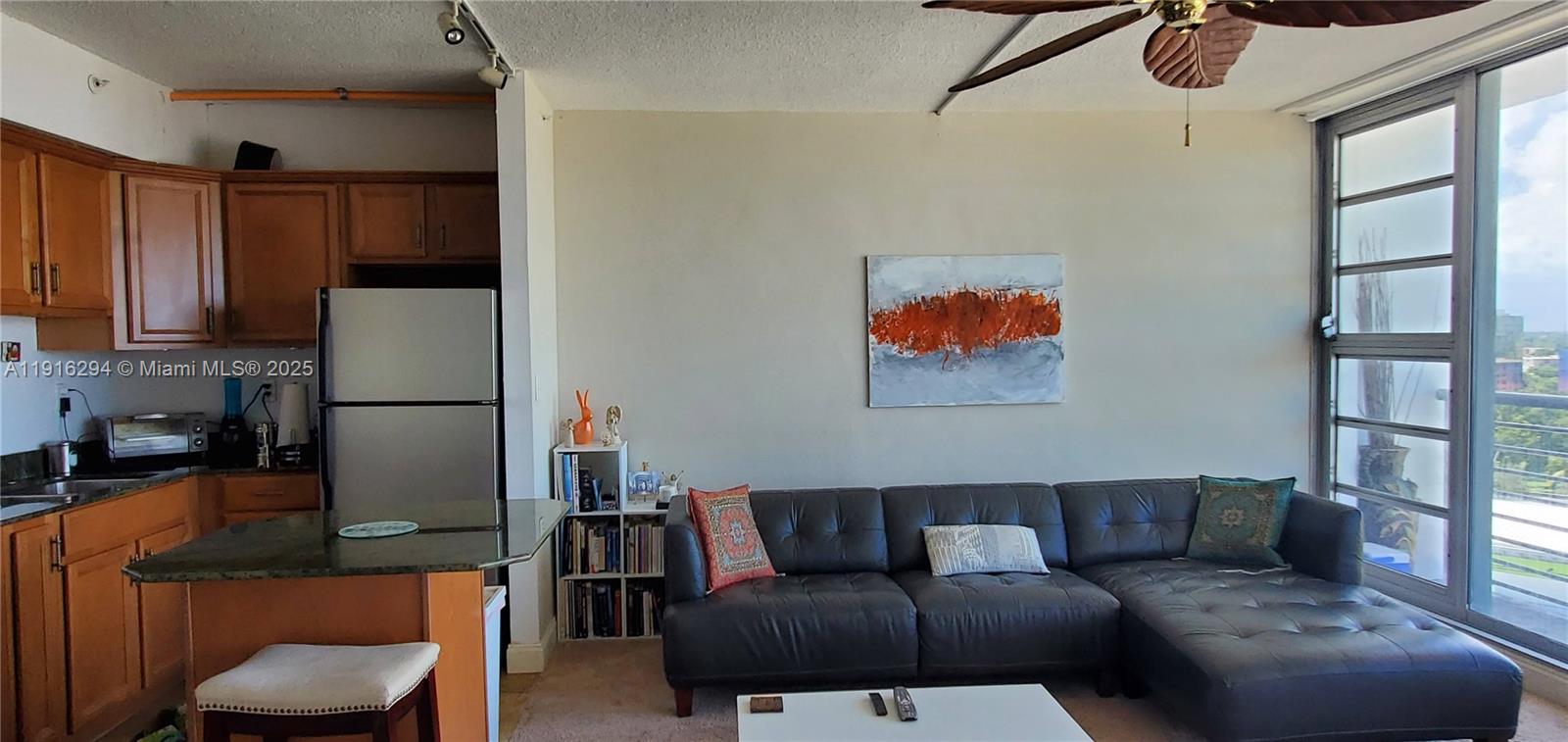 1720 Harrison Street, Unit 10G Hollywood, FL 33020 - Photo 6 of 20 a living room with furniture and a window