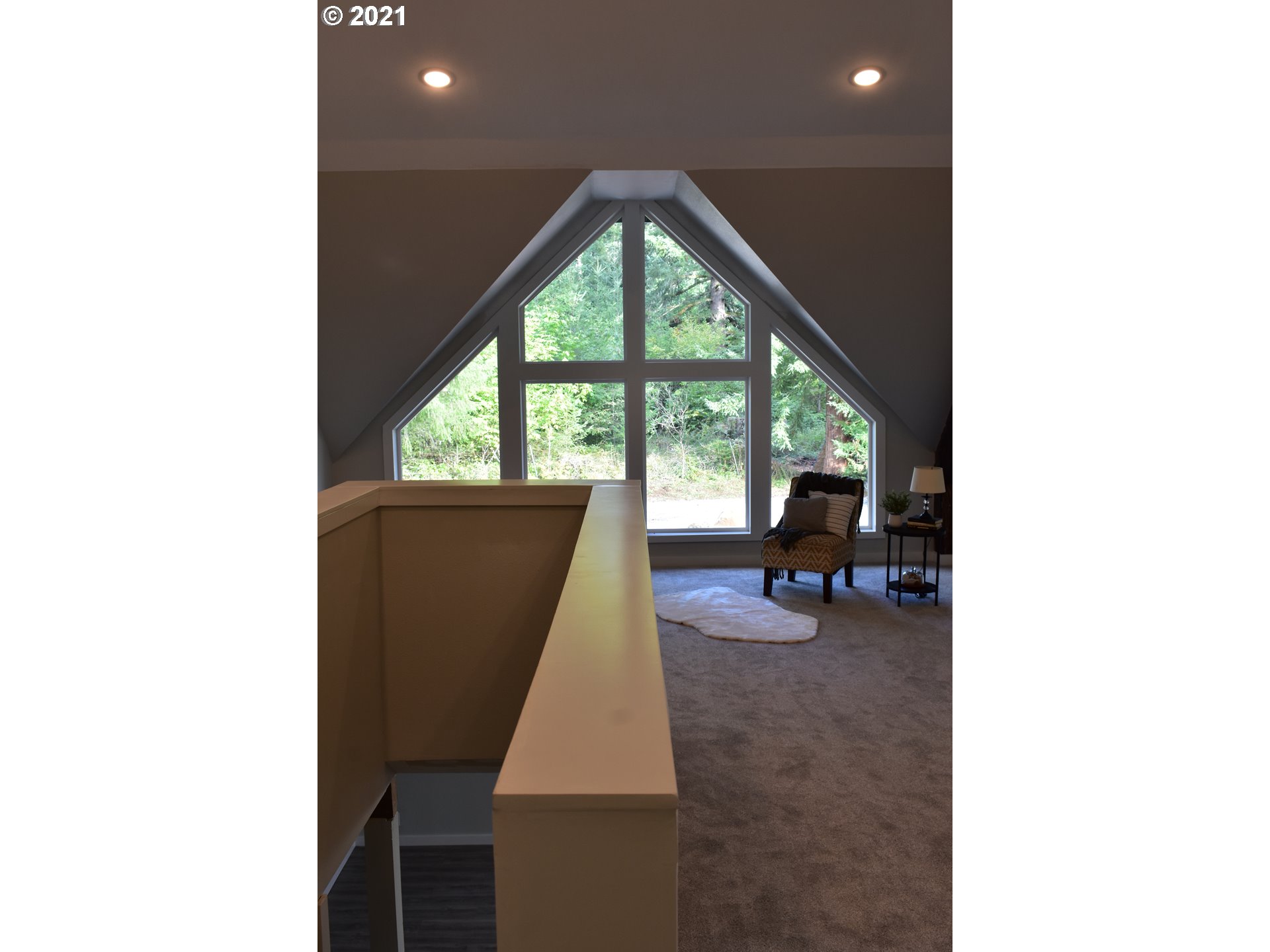 23243 South Bonney Road Colton, OR 97017 - Photo 12 of 32 a living room with furniture and a floor to ceiling window