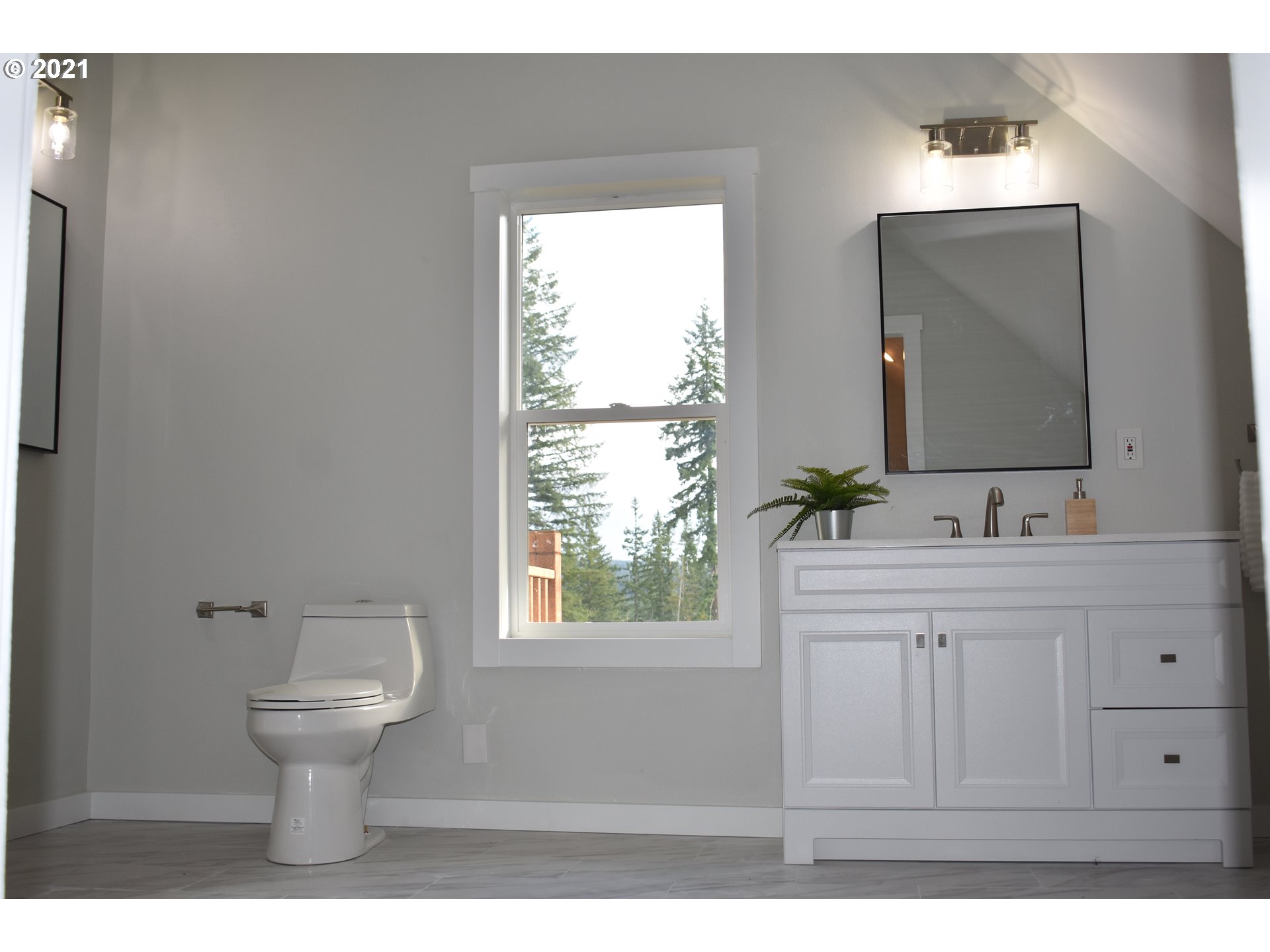 23243 South Bonney Road Colton, OR 97017 - Photo 15 of 32 a bathroom with a toilet sink and mirror
