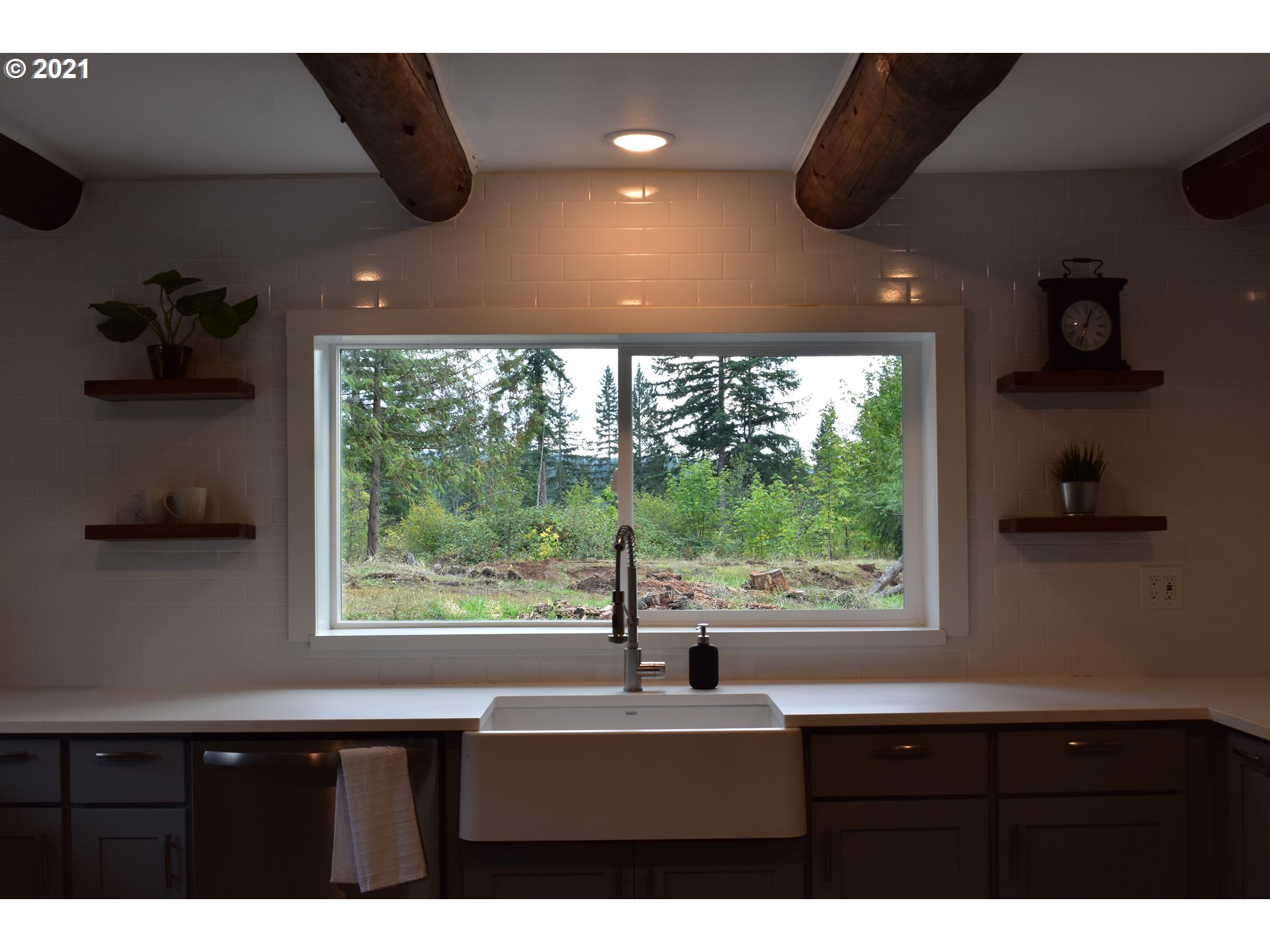 23243 South Bonney Road Colton, OR 97017 - Photo 7 of 32 a kitchen view with a sink a window and cabinets