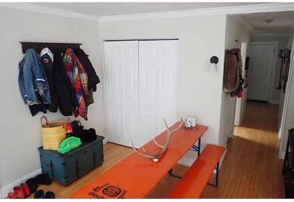 a bedroom with a bed and a mirror