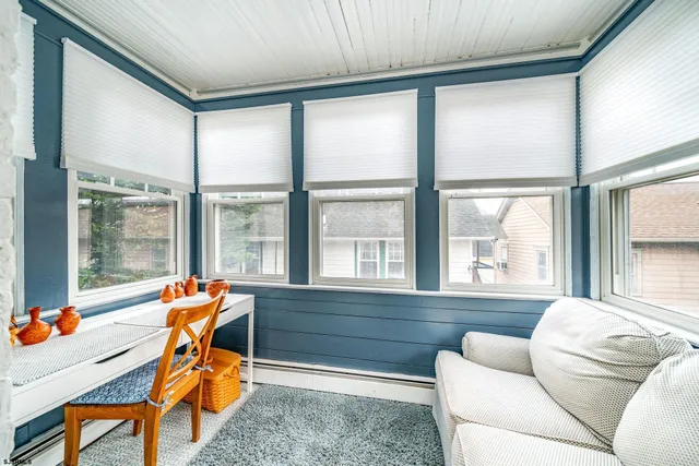 a view of a patio with table and chairs and potted plants