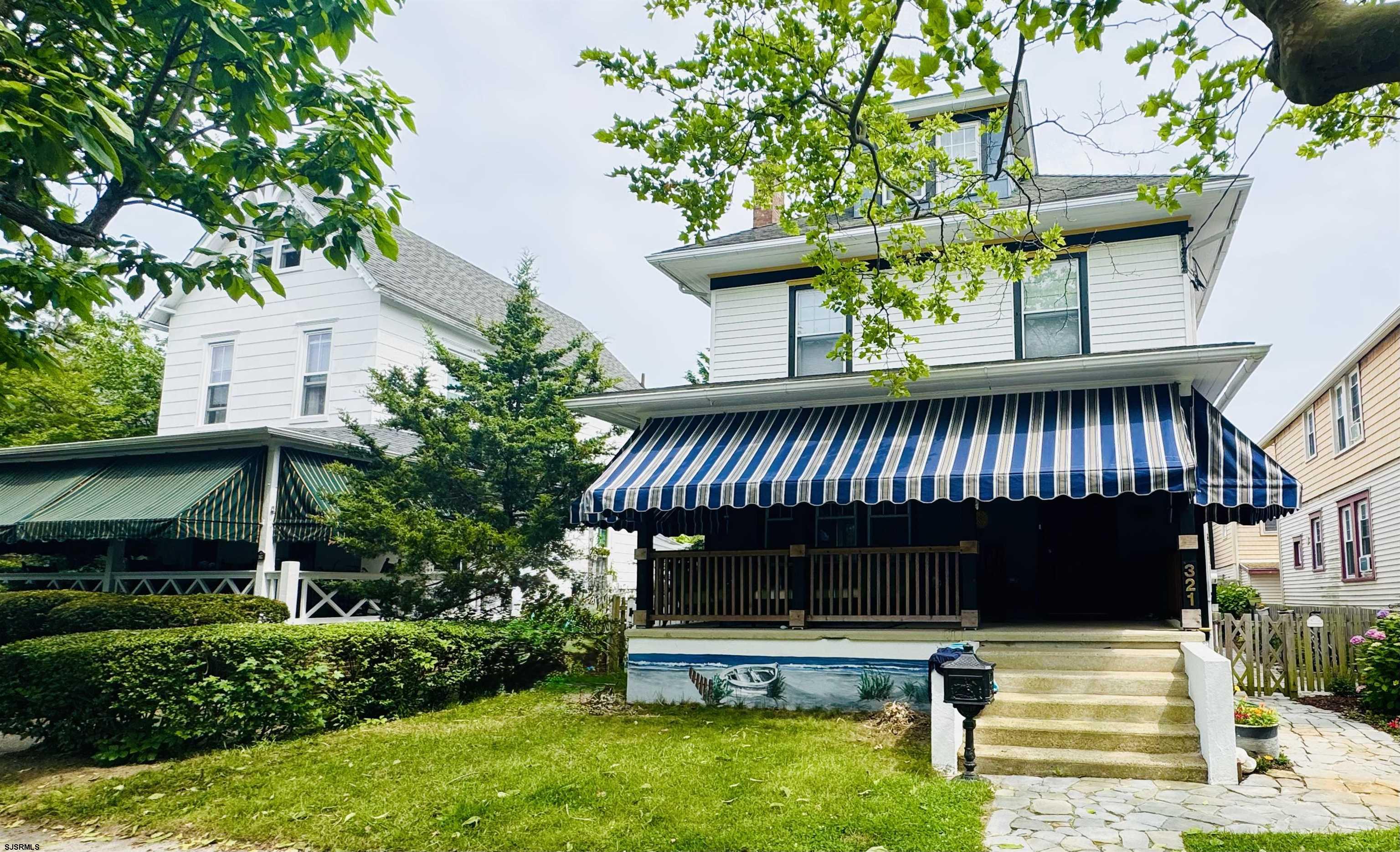 321 Central Avenue Ocean City, NJ 08226 - Photo 3 of 61 a view of small house with a yard