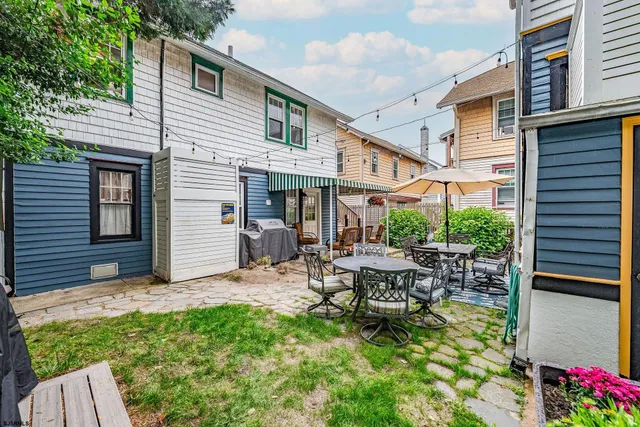 a bathroom with a sink a toilet and shower curtain