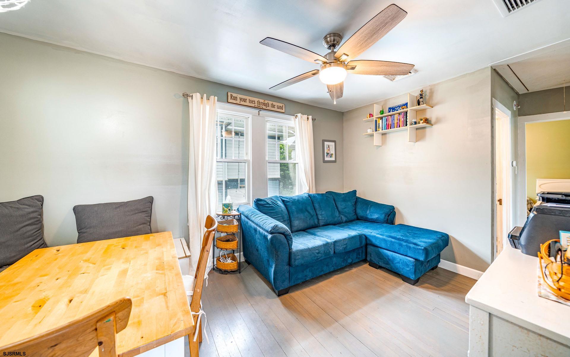 321 Central Avenue Ocean City, NJ 08226 - Photo 39 of 61 a living room with furniture and a flat screen tv