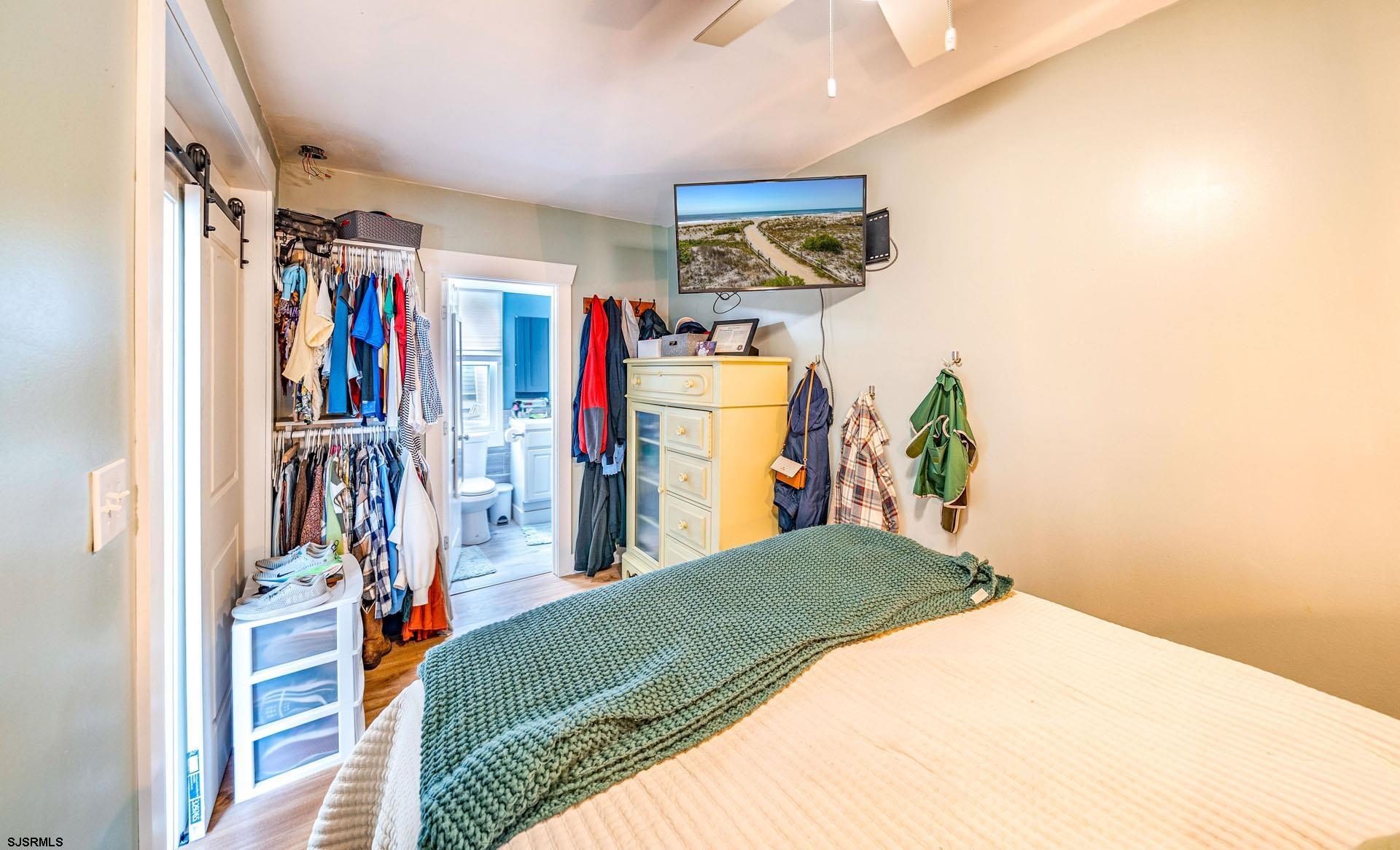 321 Central Avenue Ocean City, NJ 08226 - Photo 55 of 61 a bedroom with a bed and a window