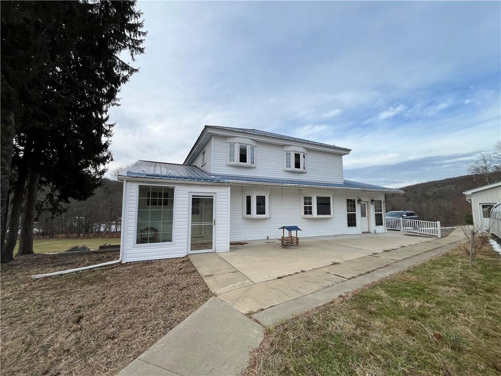 83 Seger Road Punxsutawney, PA 15767 - Photo 2 of 24 a front view of a house with a yard and garage