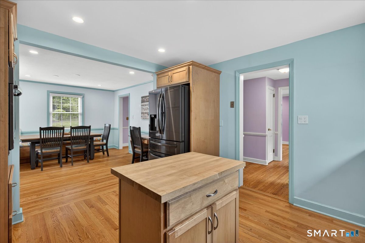 1006 King Road Cheshire, CT 06410 - Photo 6 of 40 Storage in the kitchen includes pantry cabinets and a moveable island.