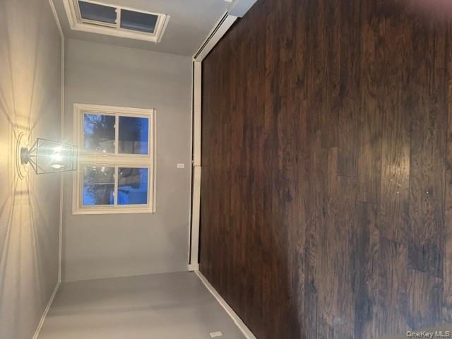 67 St George Drive Shirley, NY 11967 - Photo 9 of 11 a view of a room with wooden floor and window