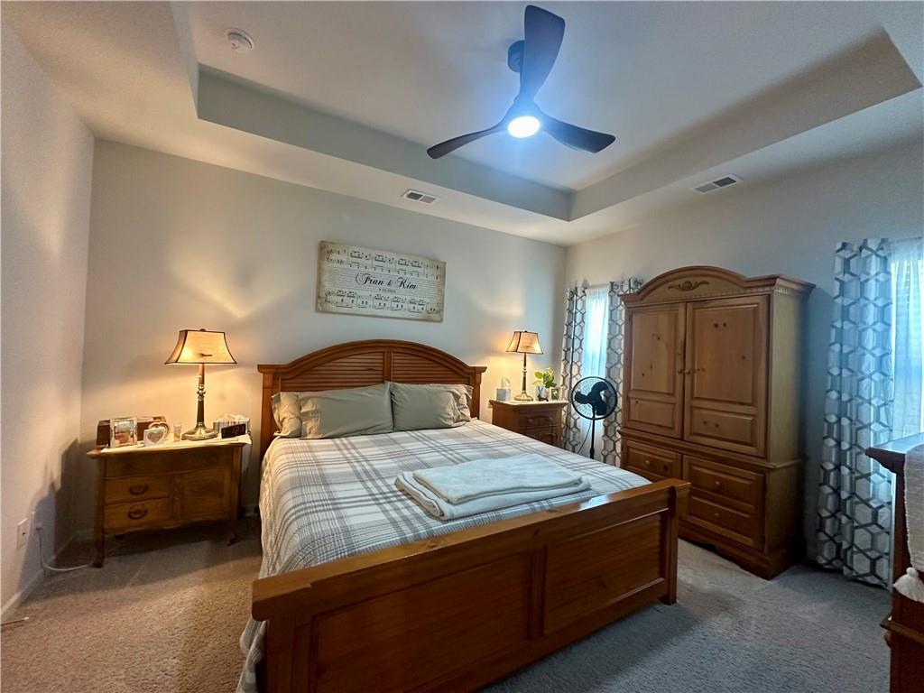 53 Bennett Way Rome, GA 30161 - Photo 42 of 42 a bedroom with a bed and a chandelier