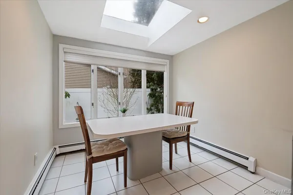 a view of a dining room with furniture and window