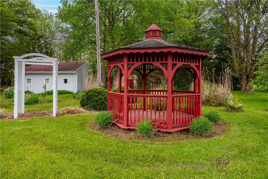 11296 Pansing Road Brookville, OH 45309 - Photo 33 of 53 This tranquil yard features a charming gazebo, perfect for relaxation and enjoying the outdoor setting.
