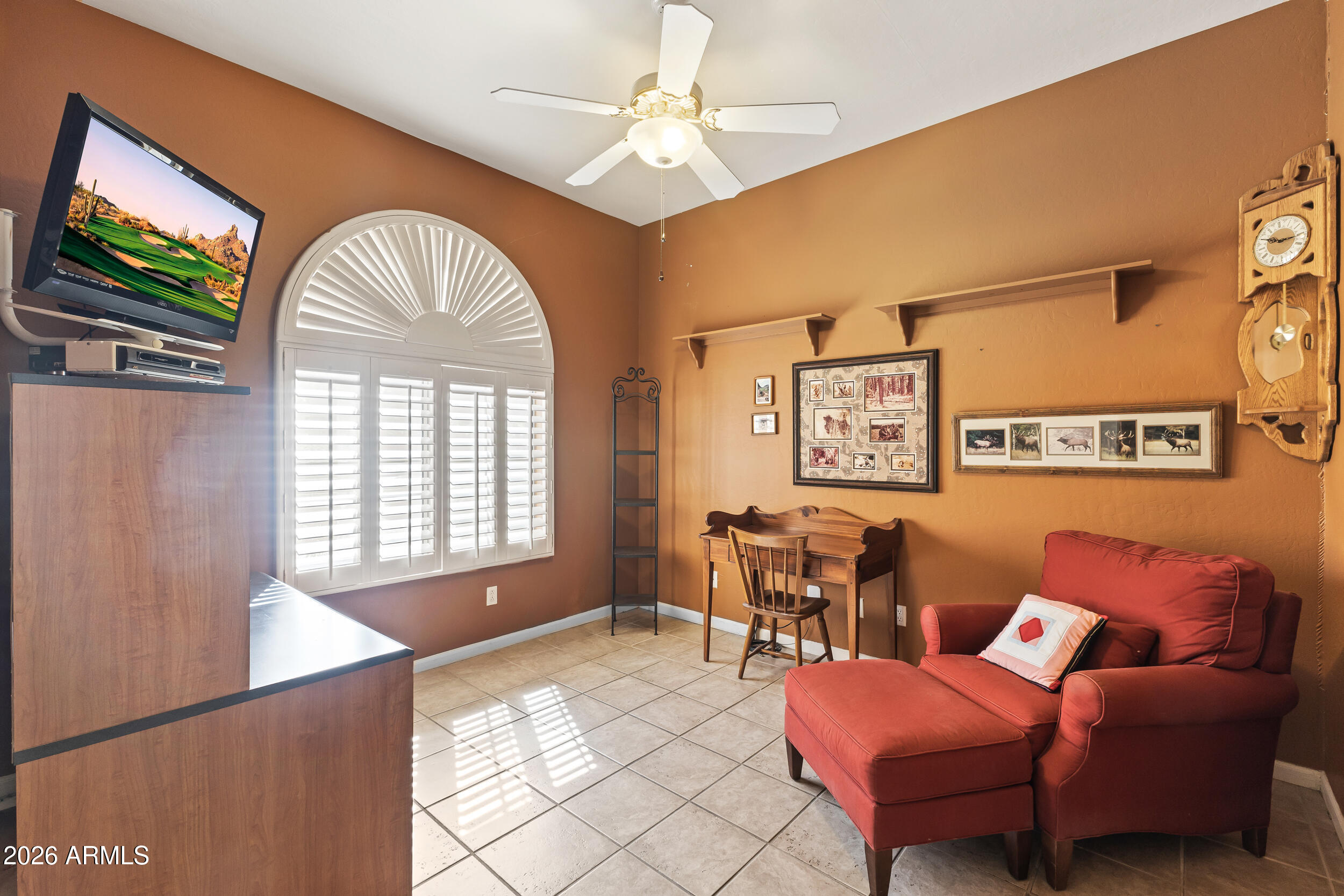 584 South Granite Street Gilbert, AZ 85296 - Photo 11 of 49 a living room with furniture and a flat screen tv