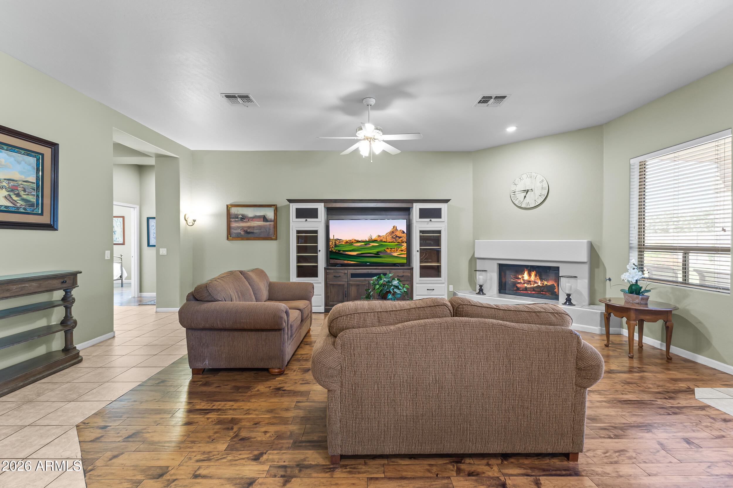 584 South Granite Street Gilbert, AZ 85296 - Photo 19 of 49 a living room with furniture large window and a fireplace