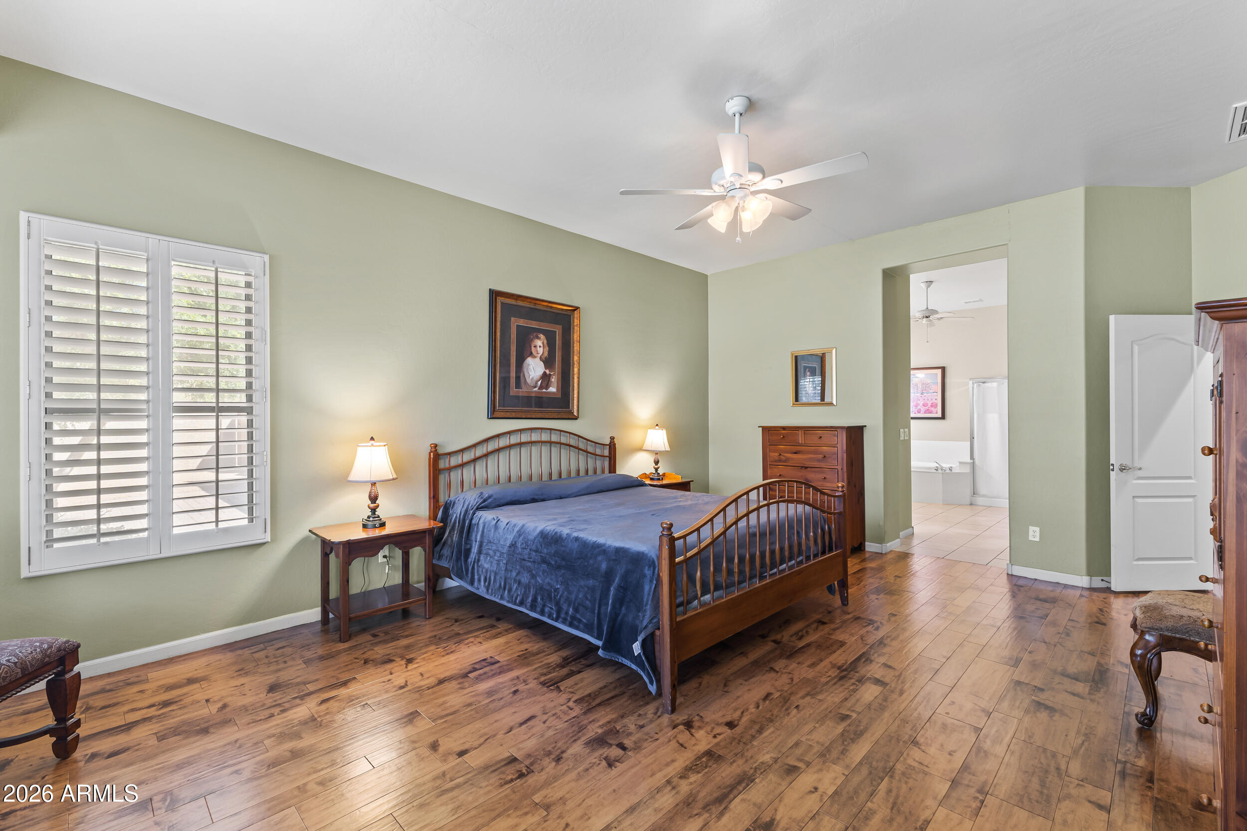 584 South Granite Street Gilbert, AZ 85296 - Photo 29 of 49 a bedroom with a bed and a table in it