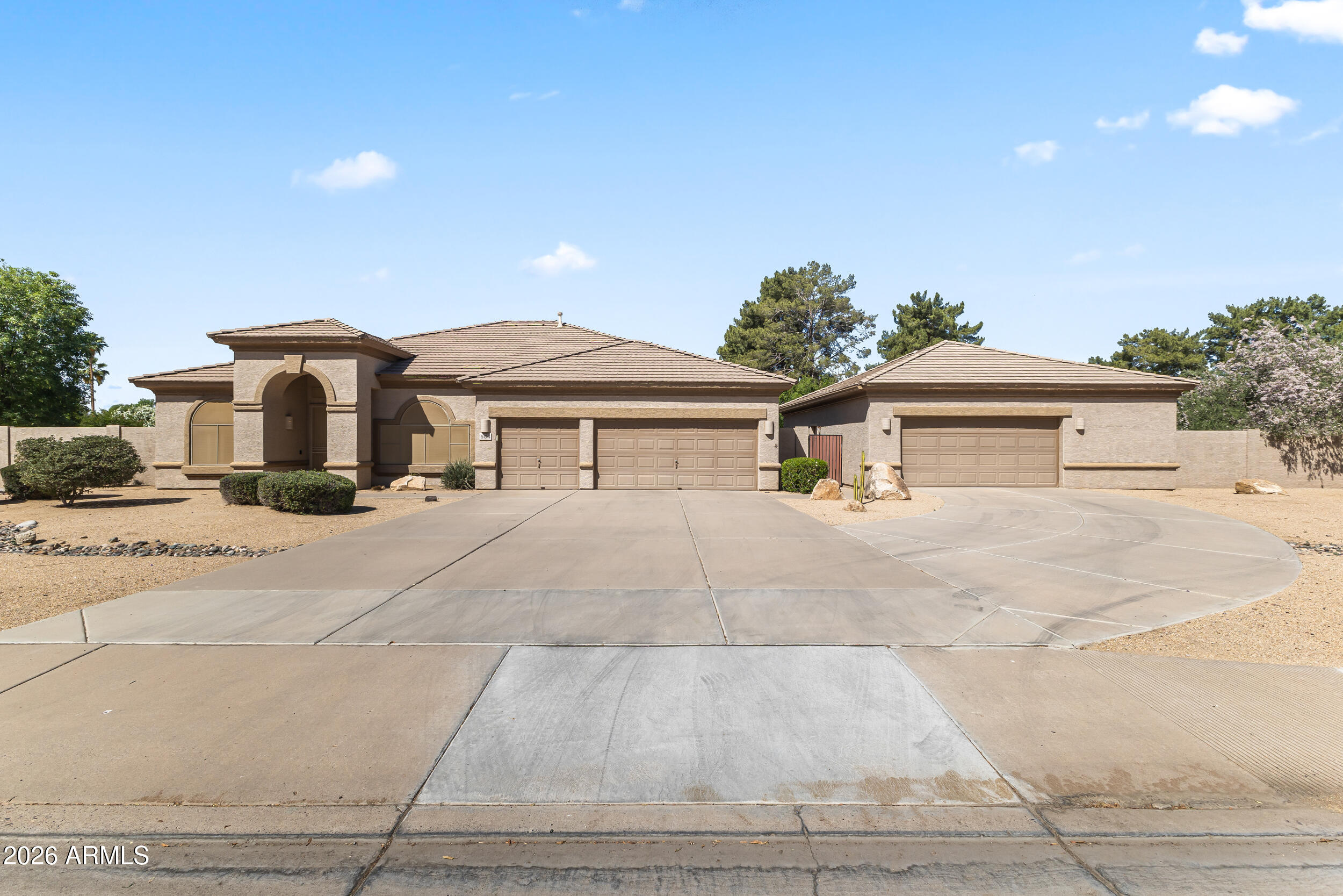 584 South Granite Street Gilbert, AZ 85296 - Photo 2 of 49 a front view of a house with a yard and garage