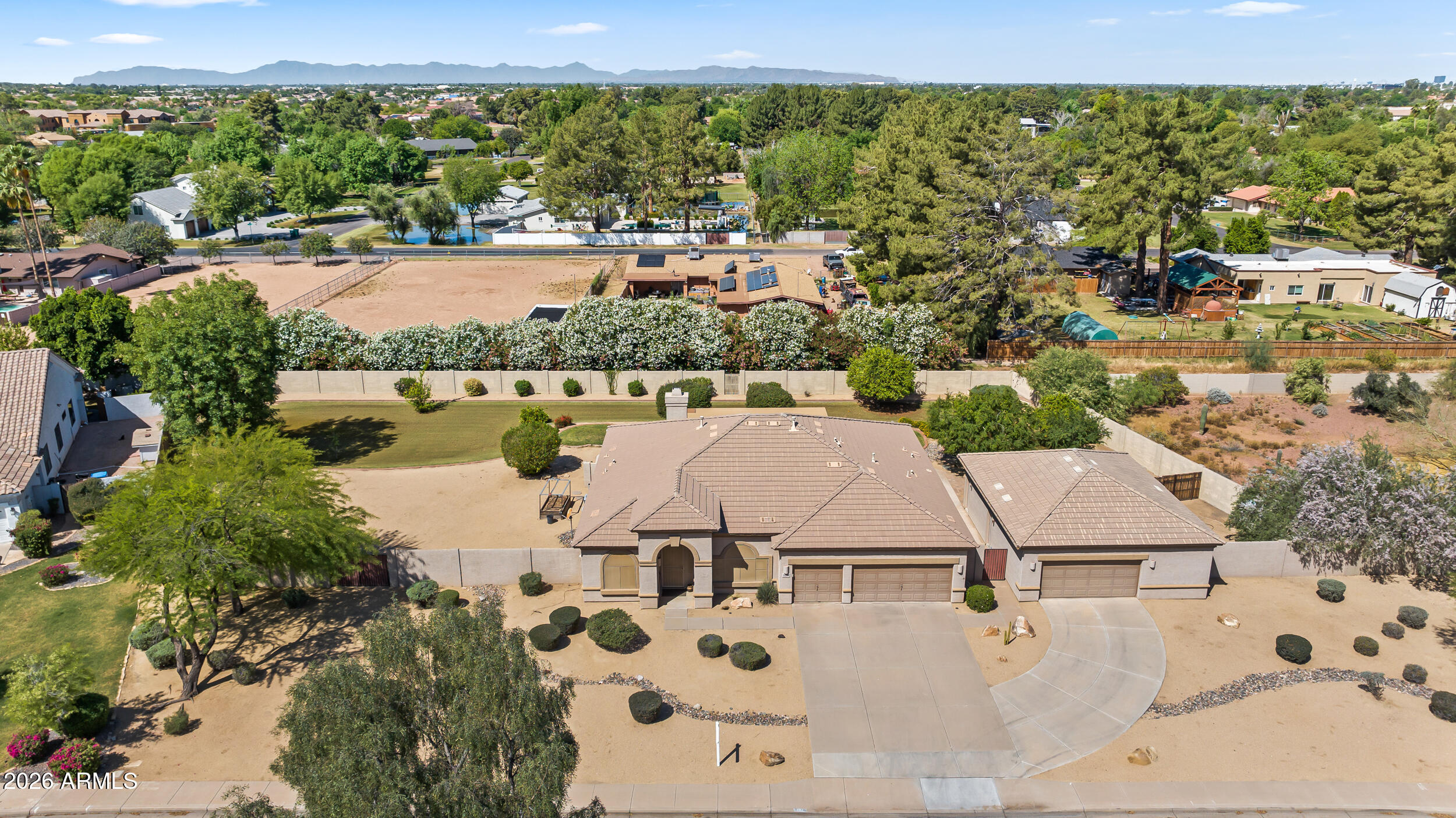 584 South Granite Street Gilbert, AZ 85296 - Photo 43 of 49 an aerial view of residential houses with outdoor space and lake view