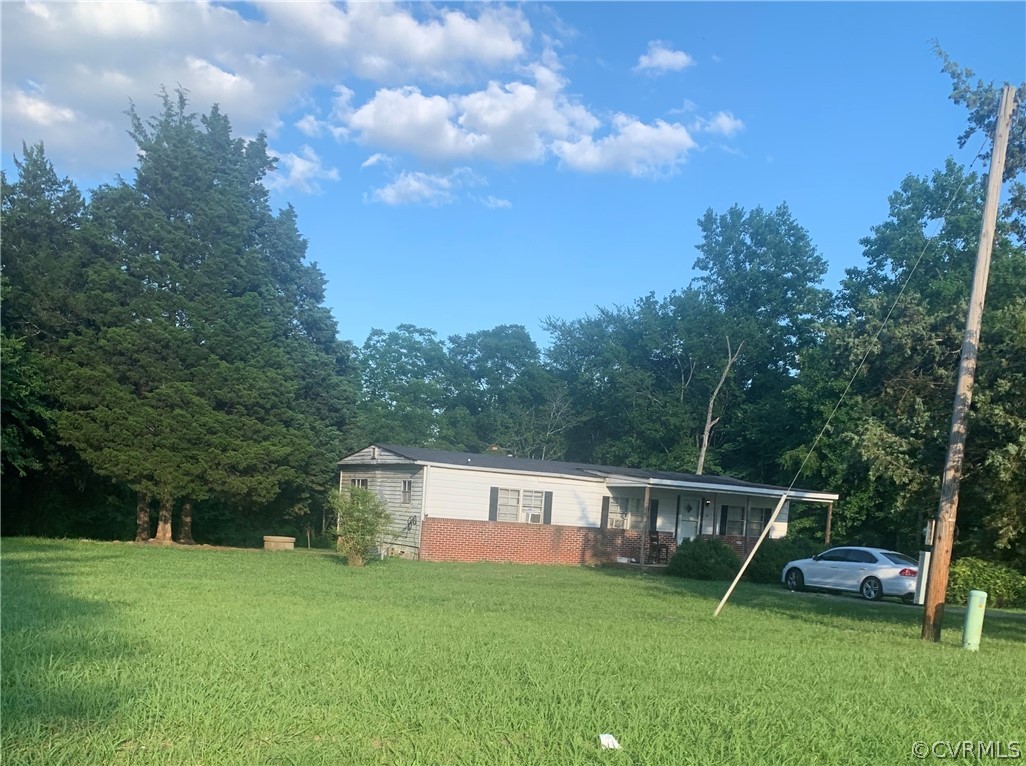 767 Stoney Point Road Cumberland, VA 23040 - Photo 1 of 3 a view of a tiny house with a park