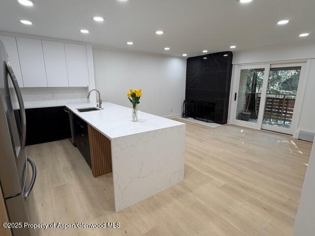 a kitchen with a sink and refrigerator