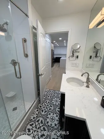 a bathroom with a sink and a mirror