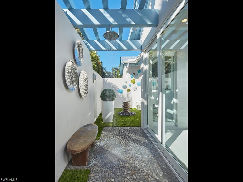 631 Broad Court North Naples, FL 34102 - Photo 14 of 23 a bathroom with a toilet and a shower