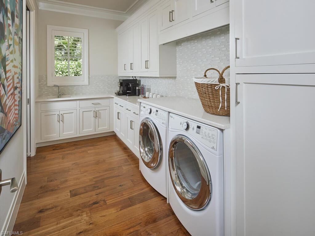 631 Broad Court North Naples, FL 34102 - Photo 16 of 23 a utility room with sink dryer and washer