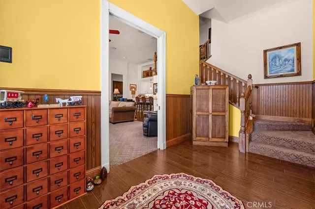a view of living room filled with furniture and toys