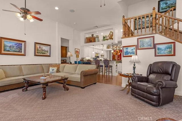 a kitchen with stainless steel appliances kitchen island granite countertop a refrigerator and a stove top oven